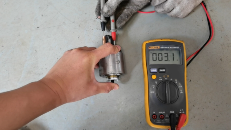 Figure 2. Starter Solenoid with a Multimeter