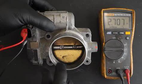 Figure 3. Throttle Position Sensor (TPS) with a Multimeter